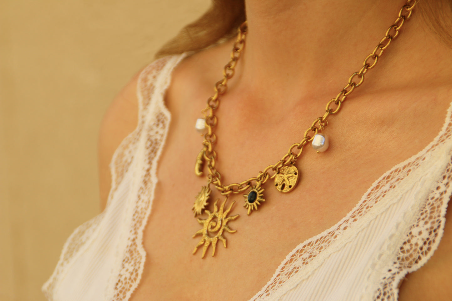 Stainless steel gold pleated necklace with charms
